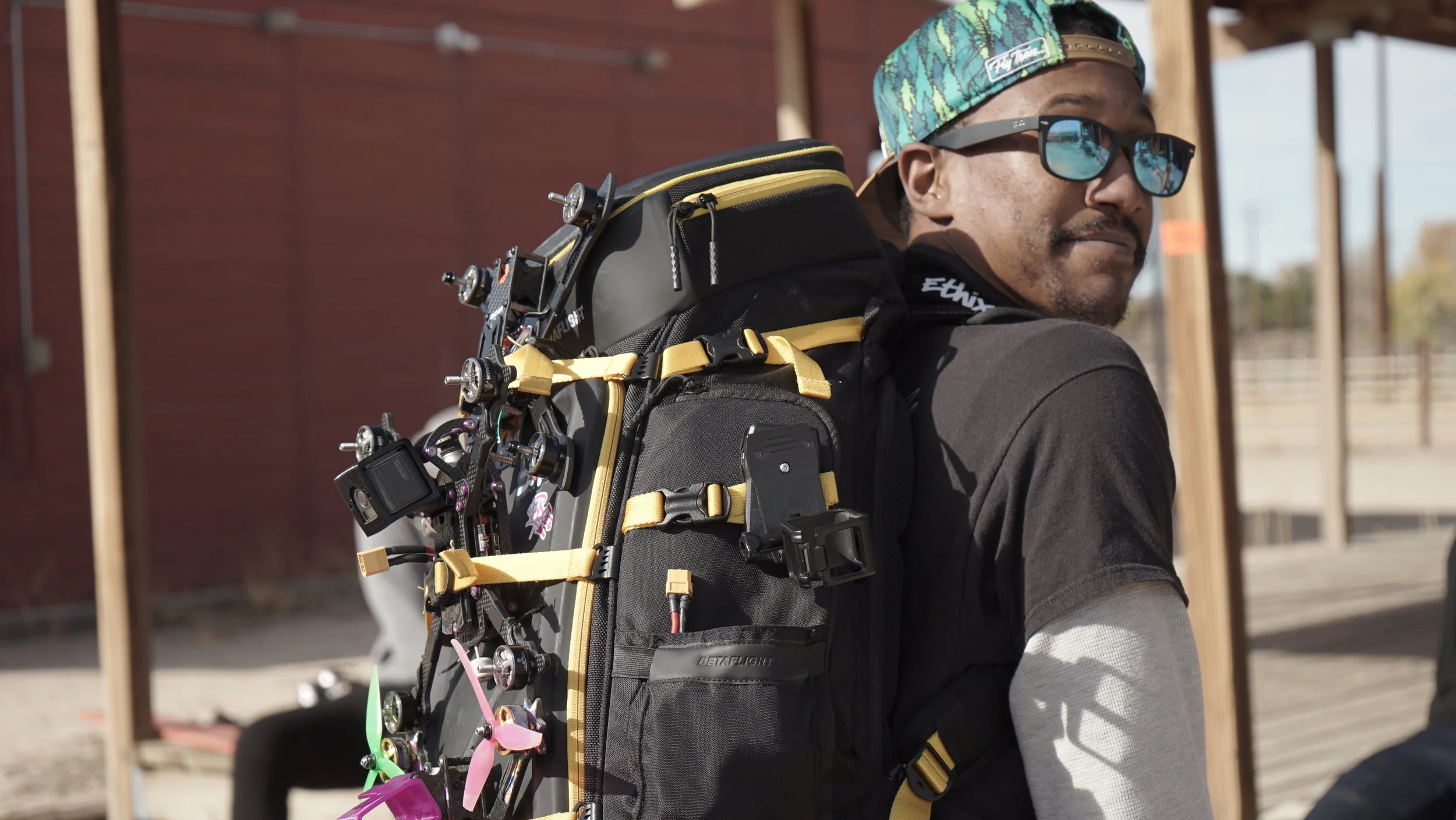 Professional drone pilot equipped with proper tactical backpack system